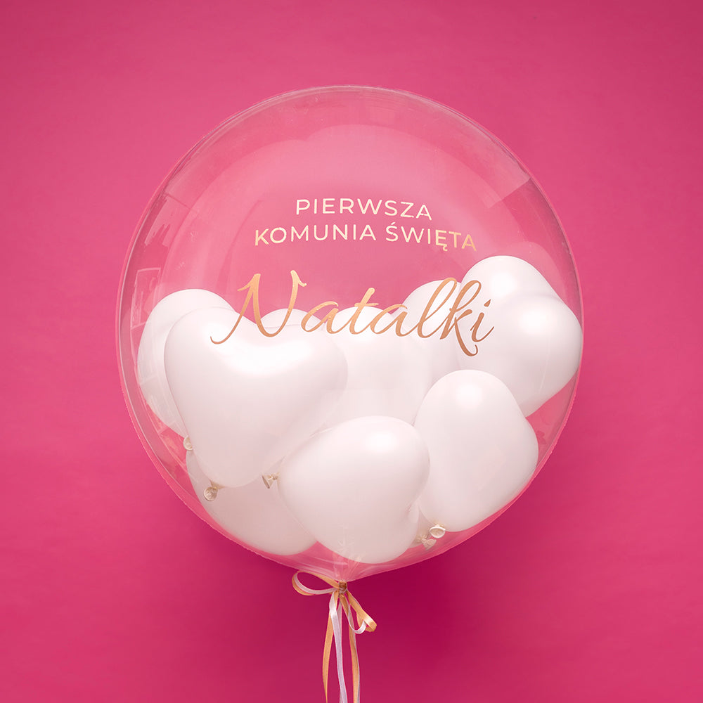 Balon bubble z helem z białymi serduszkami w środku - „Pierwsza Komunia Święta” z imieniem