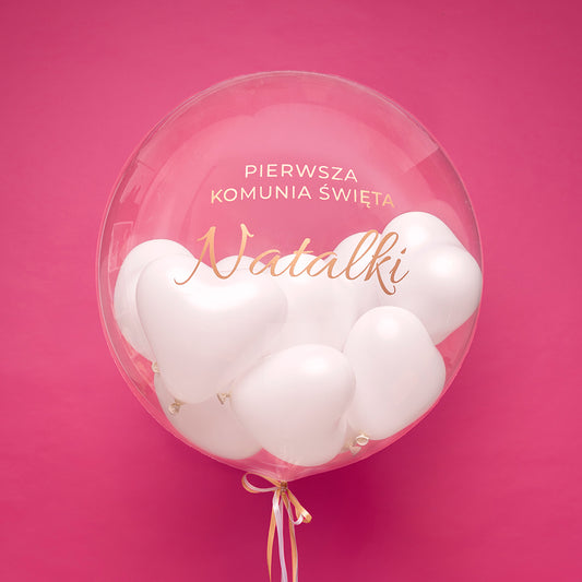 Balon bubble z helem z białymi serduszkami w środku - „Pierwsza Komunia Święta” z imieniem