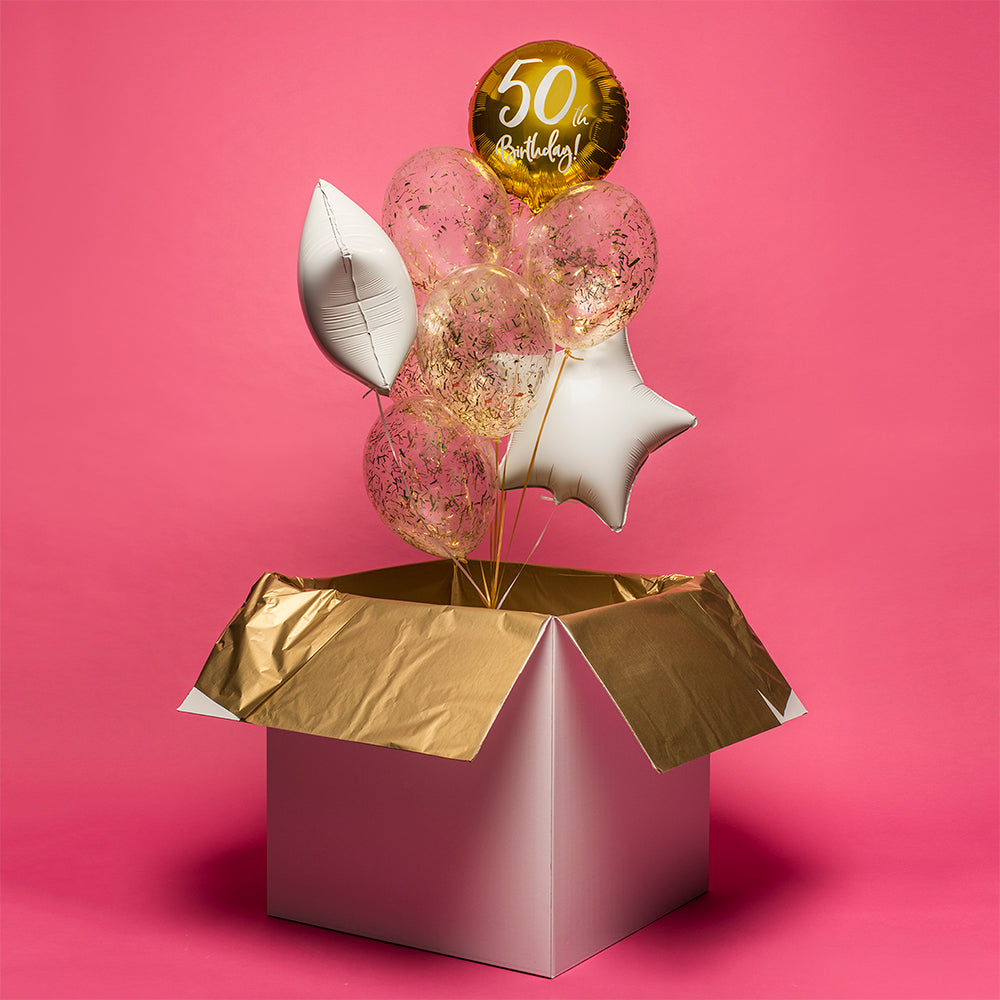 Balony z helem wyskakujące z kartonu jako niespodzianka