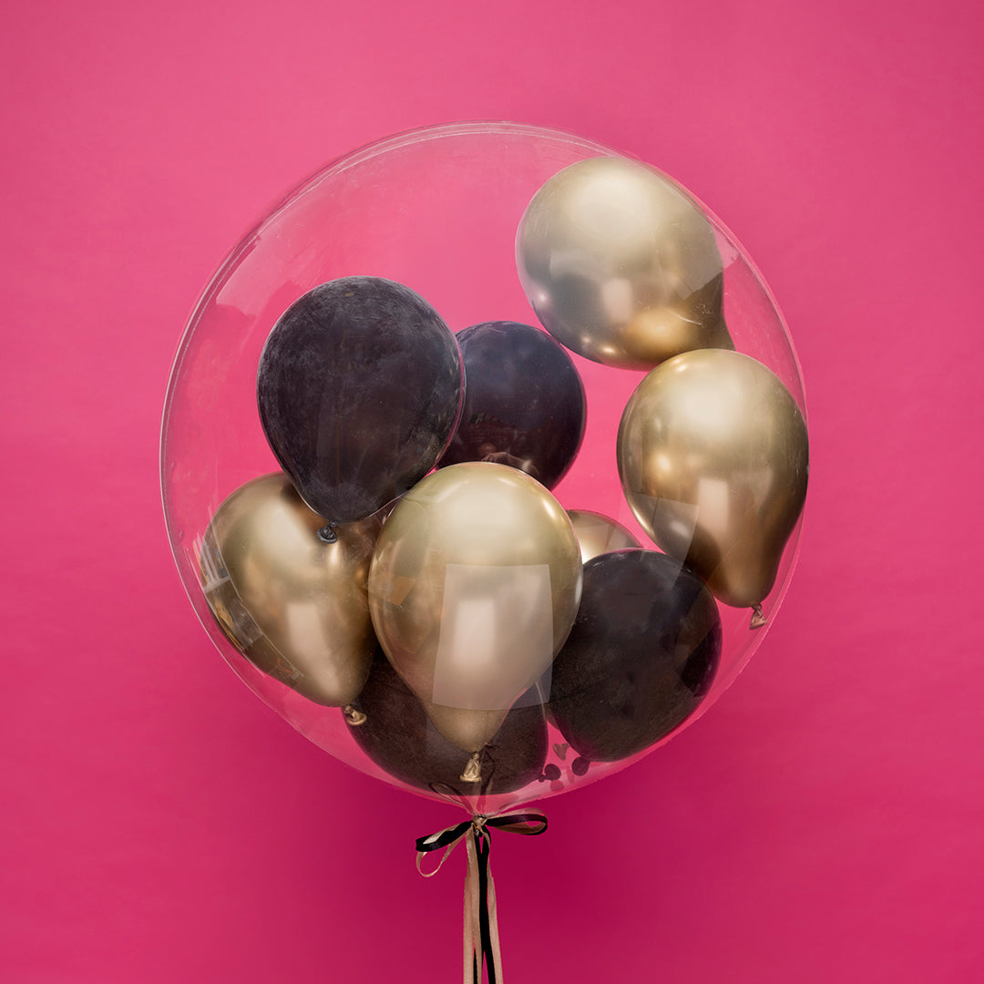 Personalizowany balon Bubble z mini balonami w środku to elegancka dekoracja na jubileusze, urodziny i wyjątkowe wydarzenia.